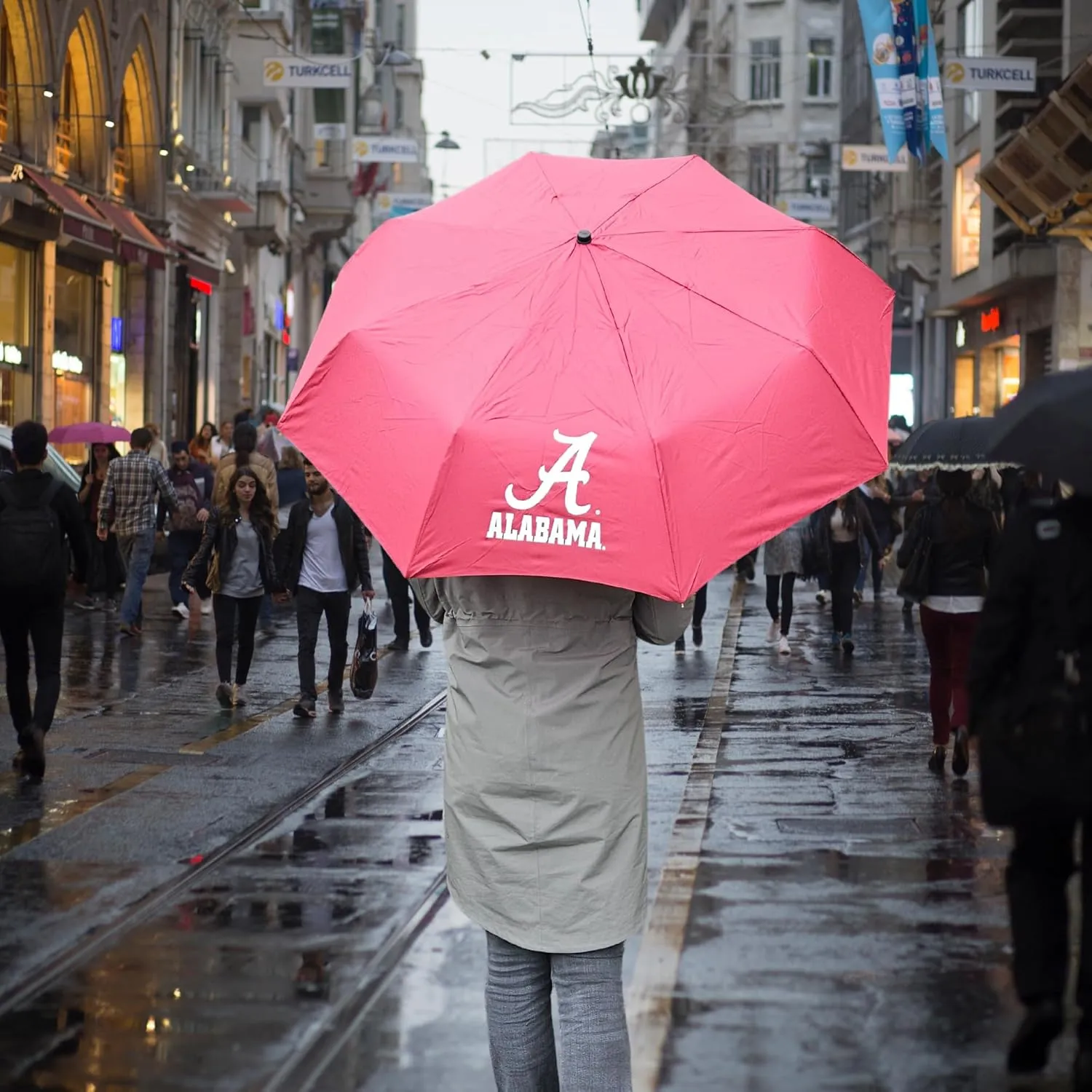 Mini Compact Storm Umbrella - NCAA Logo 42” Coverage, Folds to 11 Inches- Swivel Clip on Handle - Water, Wind & Rust Resistant, and Flexible Frame